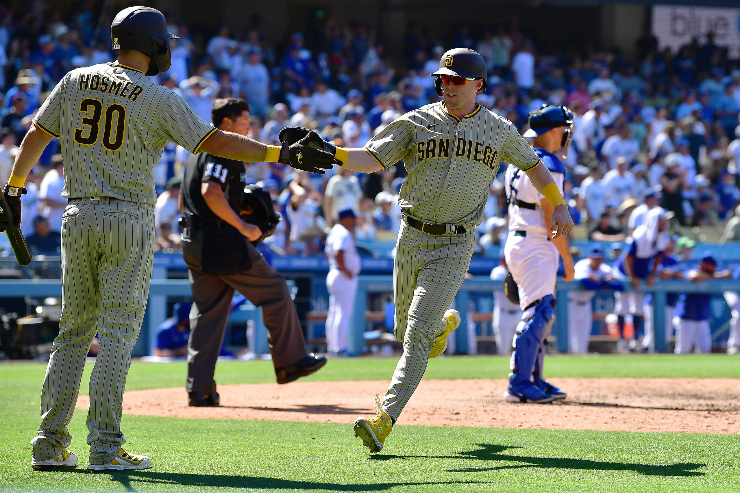 Padres rally for 4 in 9th, beat Dodgers 4-2 to avoid sweep