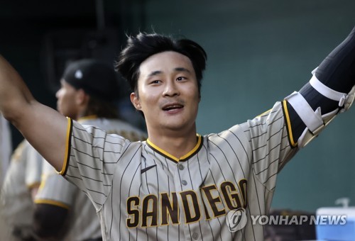 Ji Man Choi of the San Diego Padres is congratualted by Ha-Seong